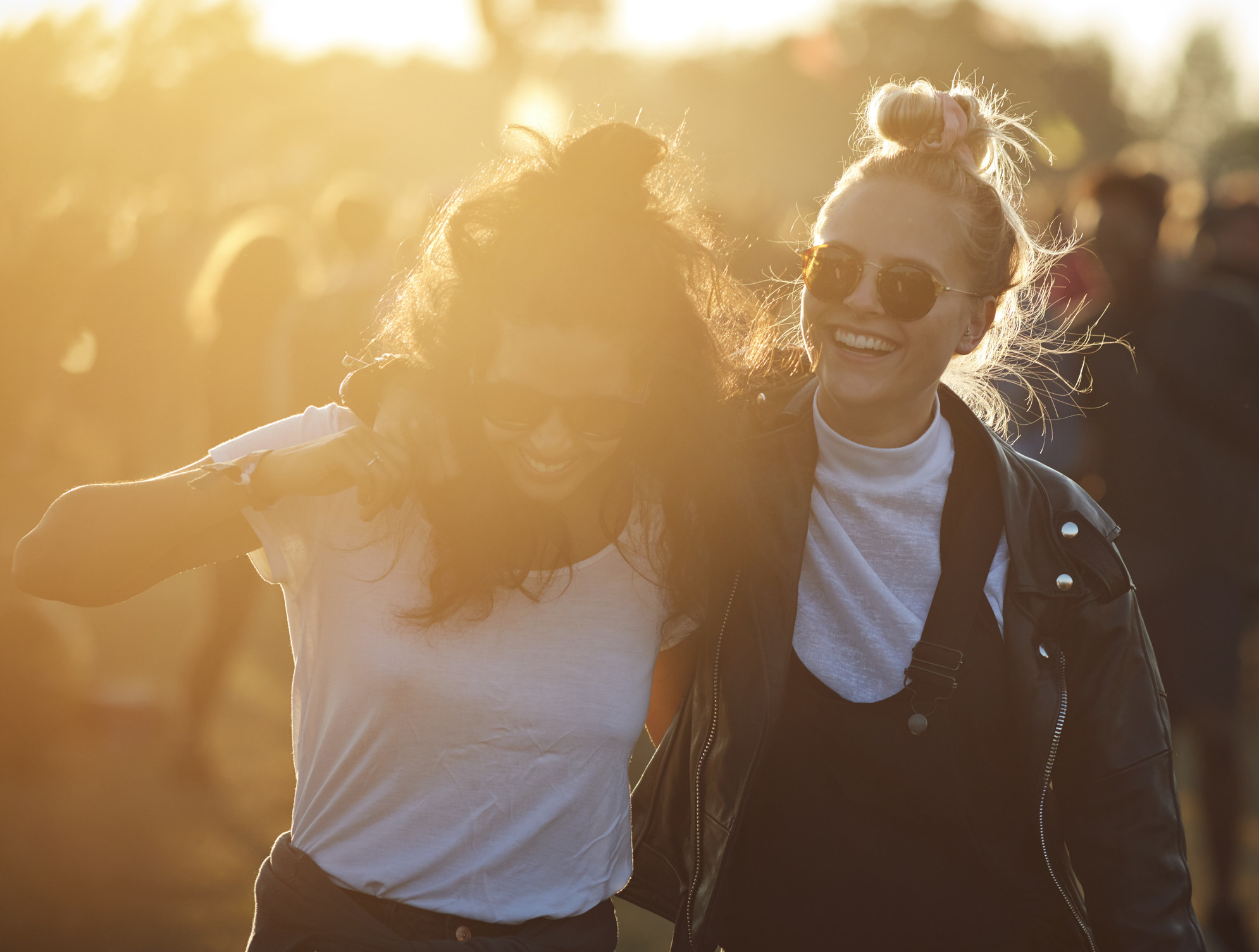 Friends hanging out at big music festival