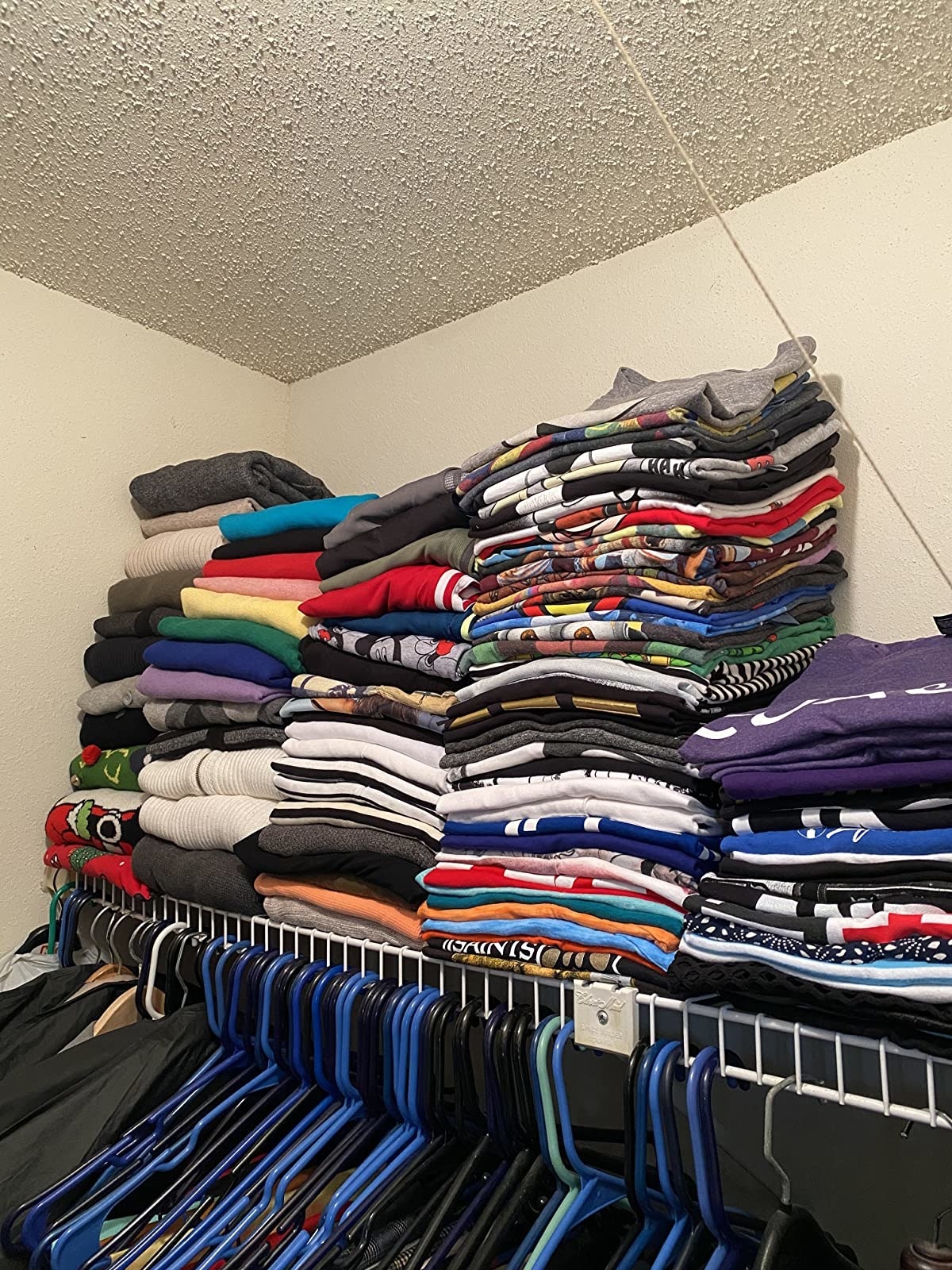 same closet full of crisply folded shirts