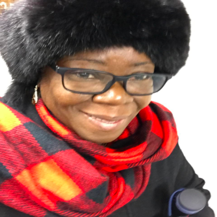 a reviewer wearing the red, black, and yellow scarf