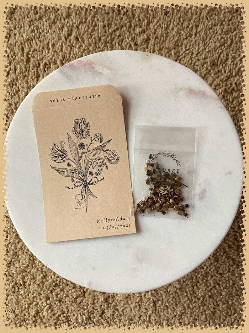 the brown seed packet with flowers and a date drawn on them