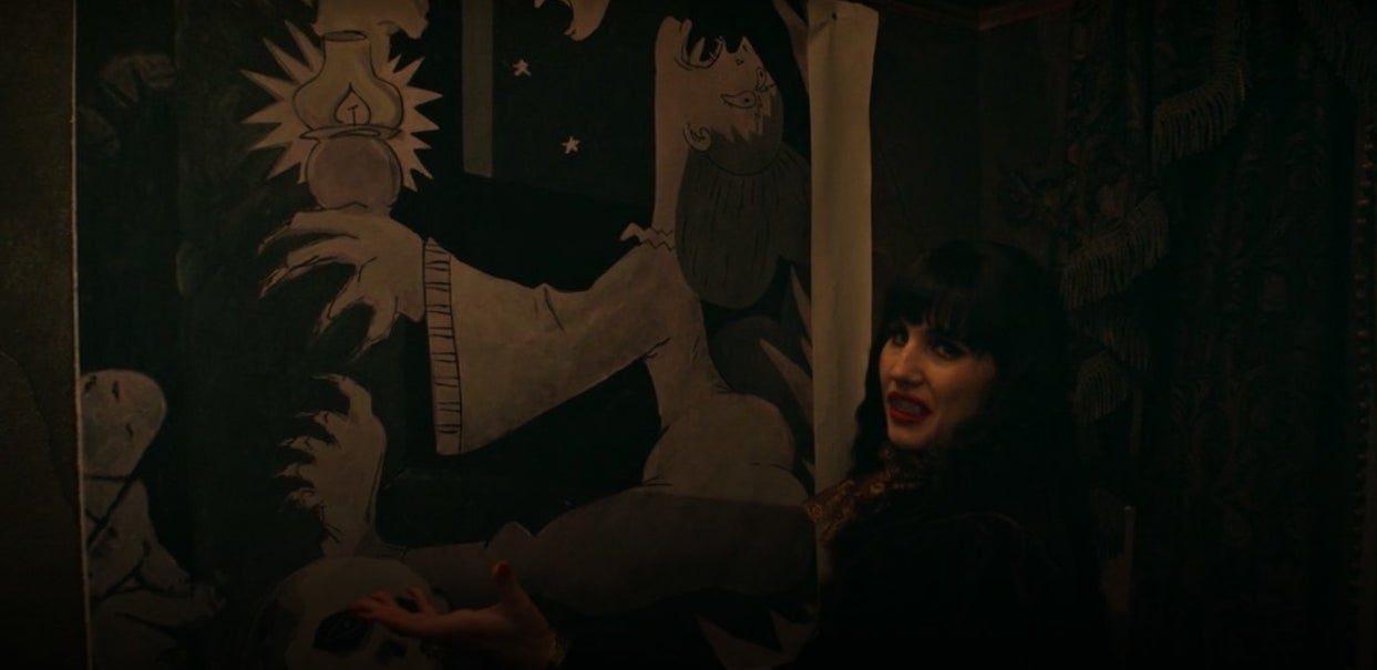 Nadja standing in front of a painting in &quot;What We Do in the Shadows&quot;