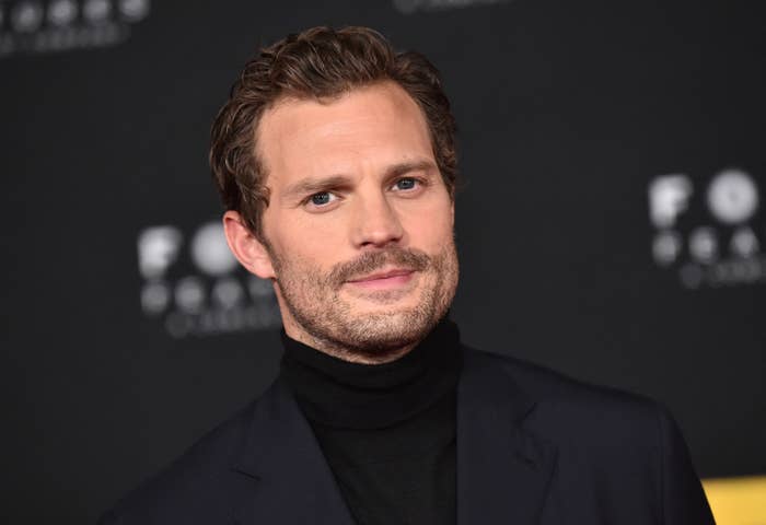 Jamie poses for photographers at a red carpet event