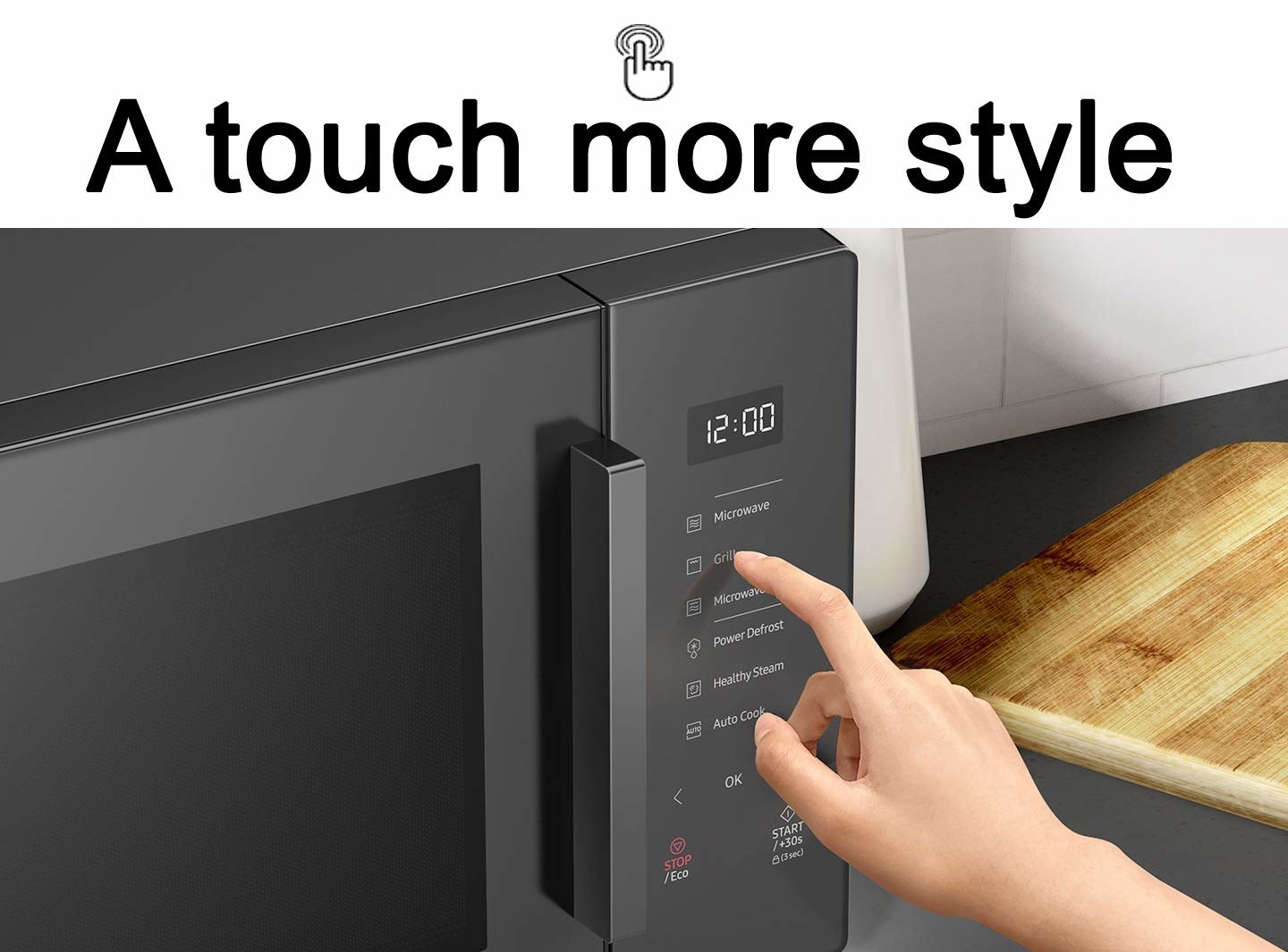 A person touching microwave controls