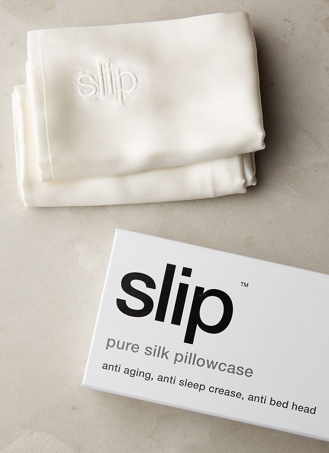 white slip silk pillowcase next to its box