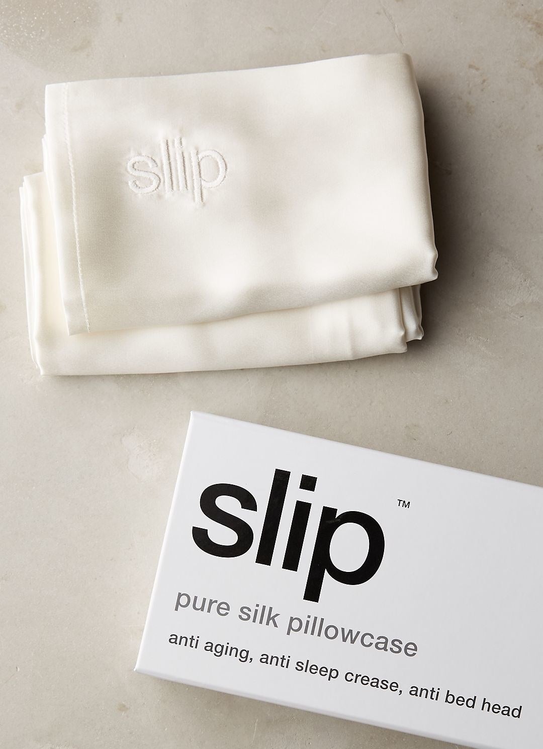white slip silk pillowcase next to its box