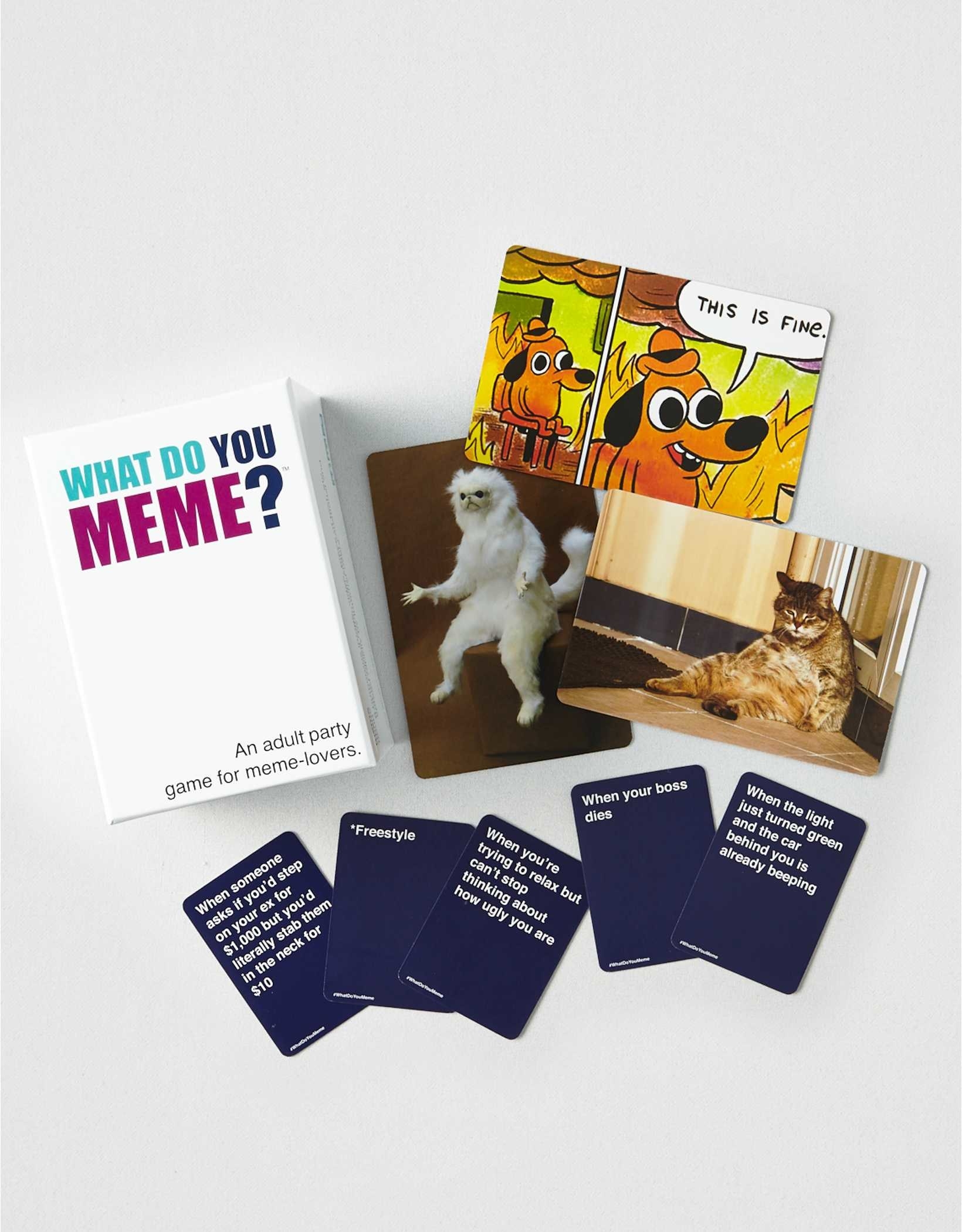 The game showing three memes and an assortment of caption cards