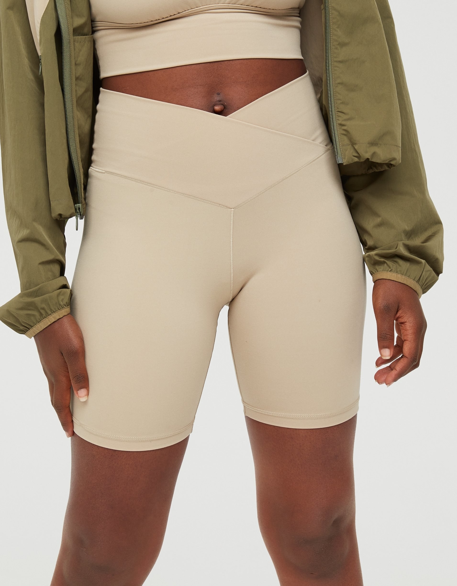 model in light tan cross waistband bike shorts
