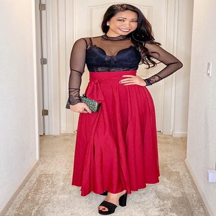 Reviewer wearing the red maxi skirt