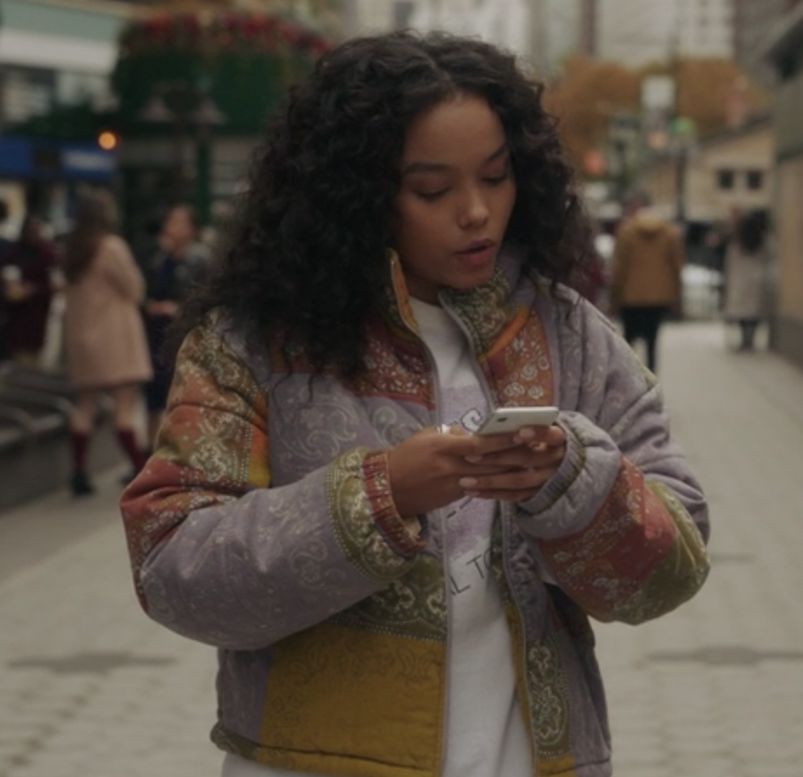 Zoya Lott wears a paisley patterned jacket over a t-shirt