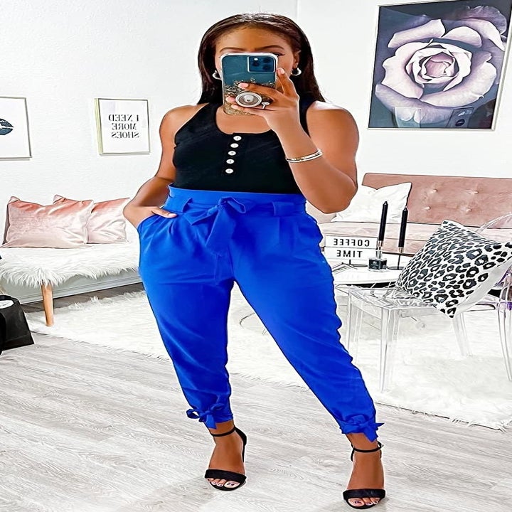 Reviewer wearing the blue high-waisted pants