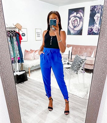 Reviewer wearing the blue high-waisted pants