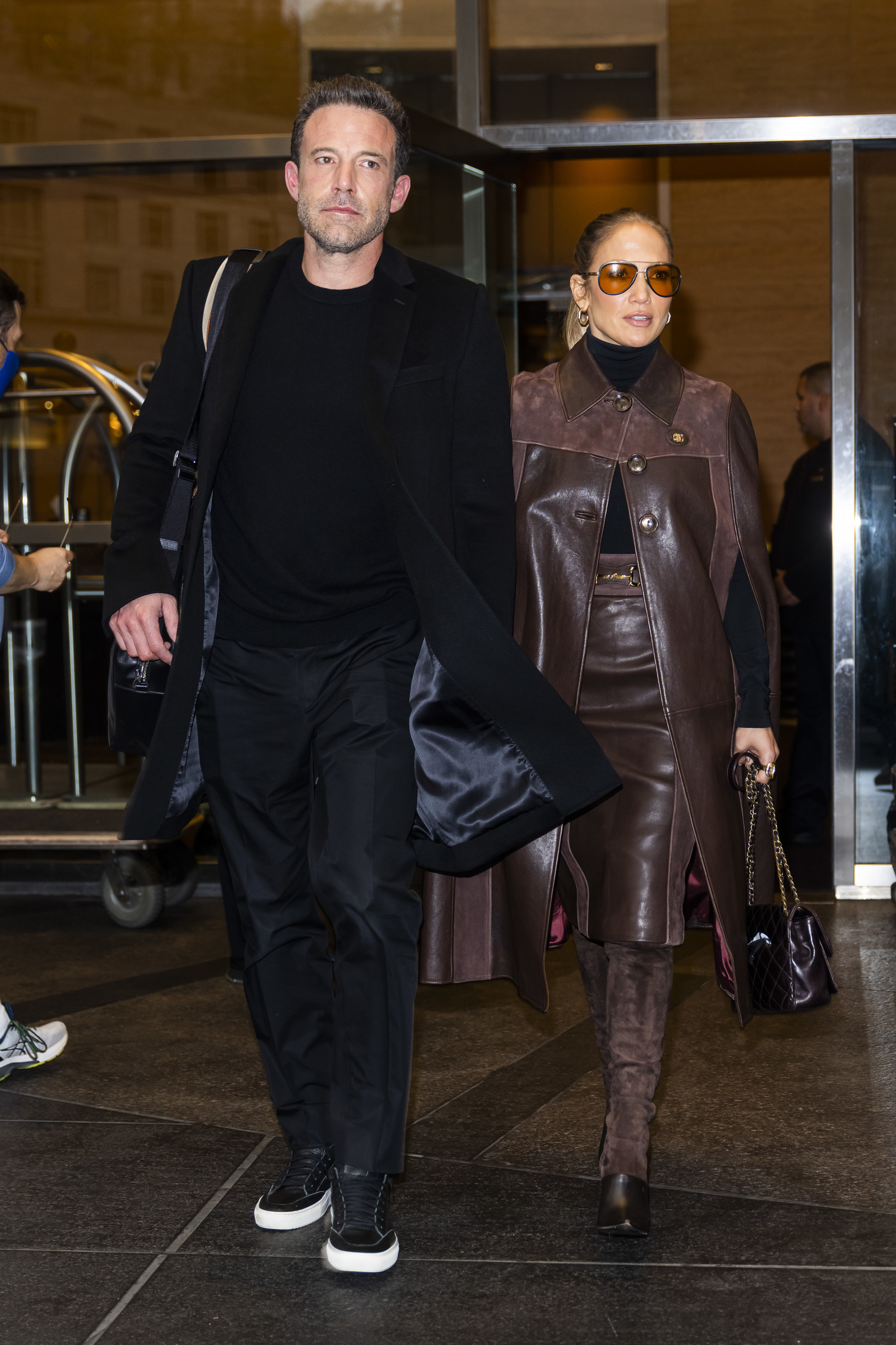 The couple walking out of a hotel together