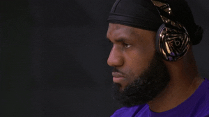 LeBron James vibing to music while wearing headphones