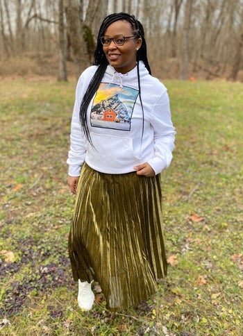 Reviewer wearing the gold metallic skirt