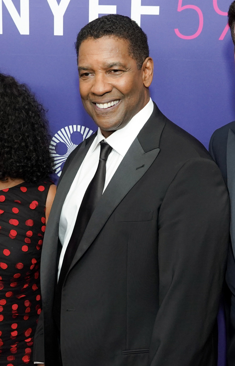 Denzel smiling at the 59th New York Film Festival Opening Night at Lincoln Center