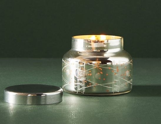 candle in a silver pearlescent tin
