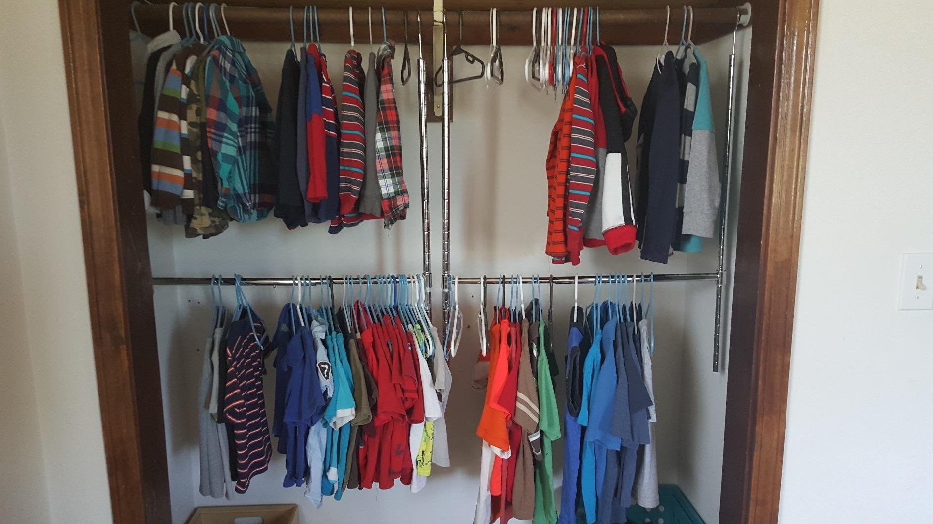 A reviewer&#x27;s closet with two of the rods installed
