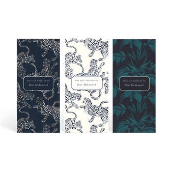 three notebooks with tiger and tropical patterns on them