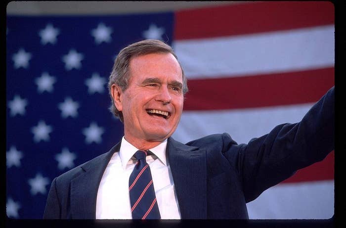 George Bush waves to a crowd of supporters