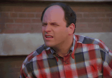 George Costanza squinting then gasping