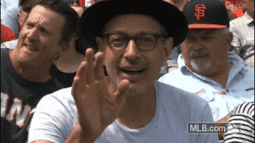 Jeff Goldblum waving at the camera