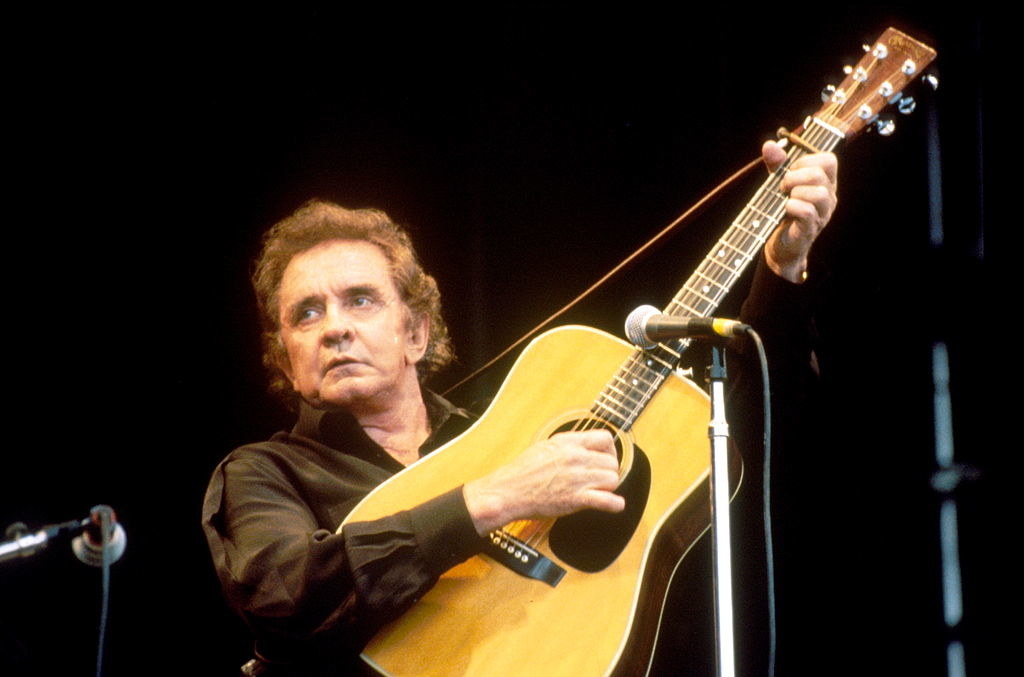 Johnny Cash performs onstage at Glastonbury Festival