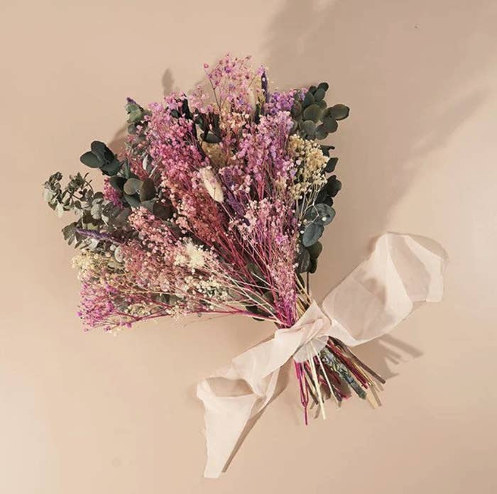 the dry bouquet with purple, pink, yellow, and green flowers