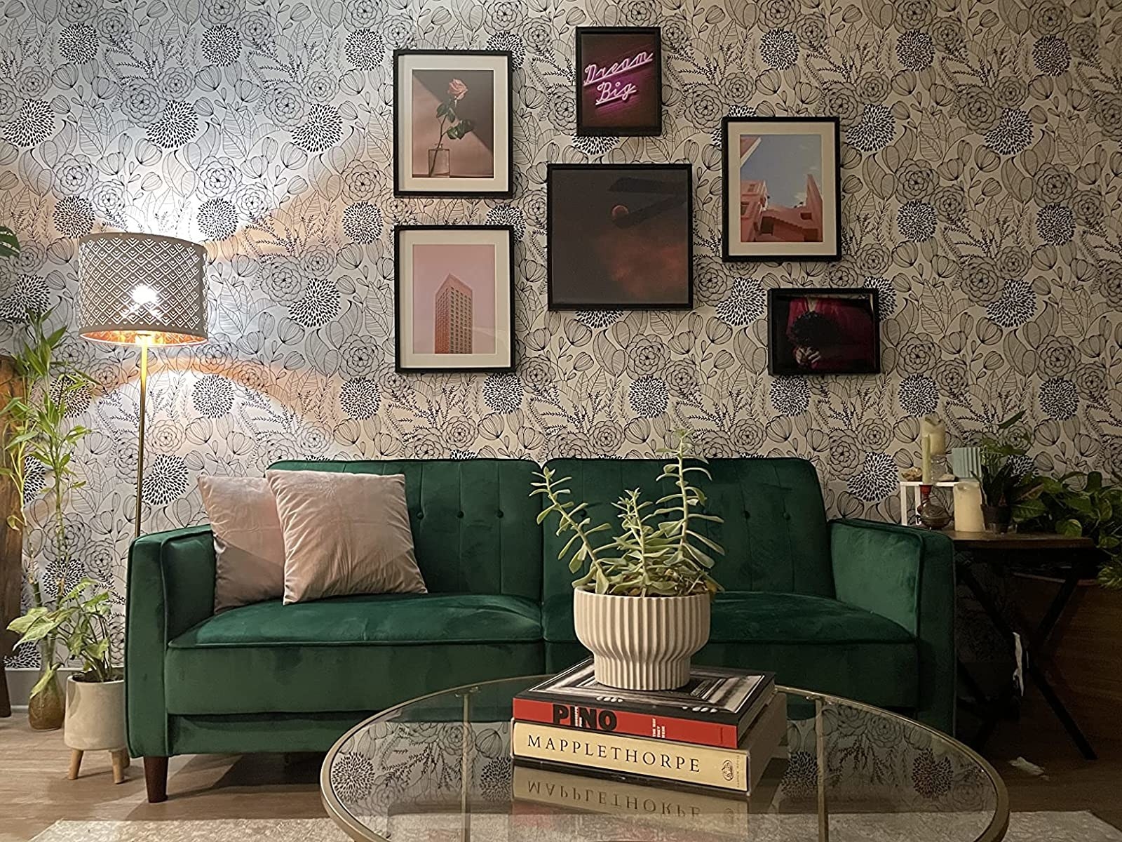 Reviewer image of wallpaper behind green couch in living room