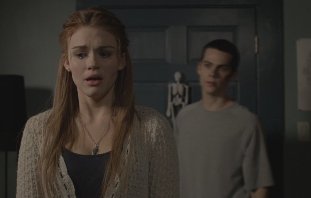 Lydia from &quot;Teen Wolf&quot; cries and looks afraid, with Stiles watching from the background