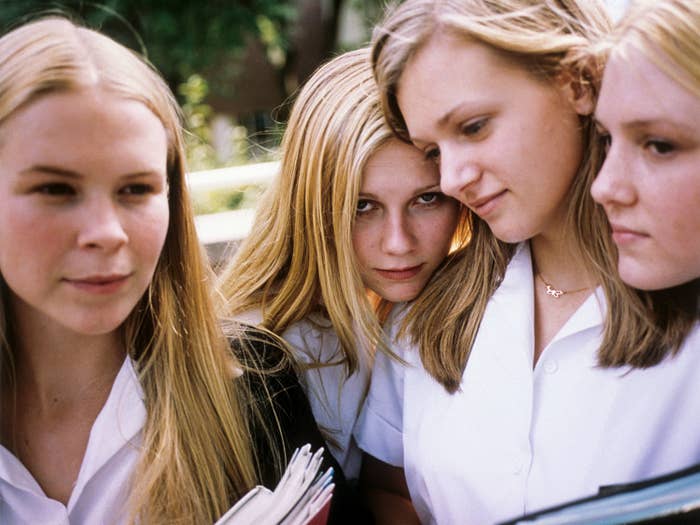 Dunst rests her head on her co-star&#x27;s shoulders in a photo for The Virgin Suicides