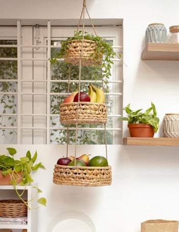 the hanging baskets holding fruit in each tier