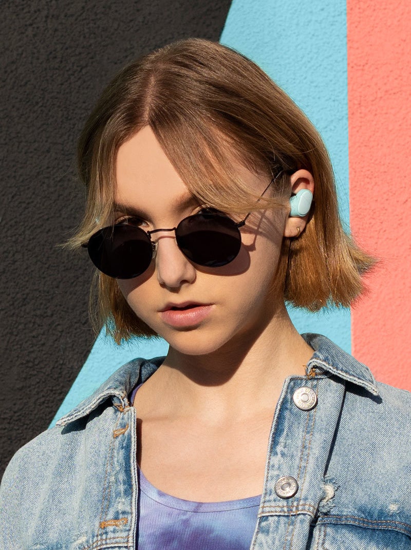 a person wearing the petite ear buds