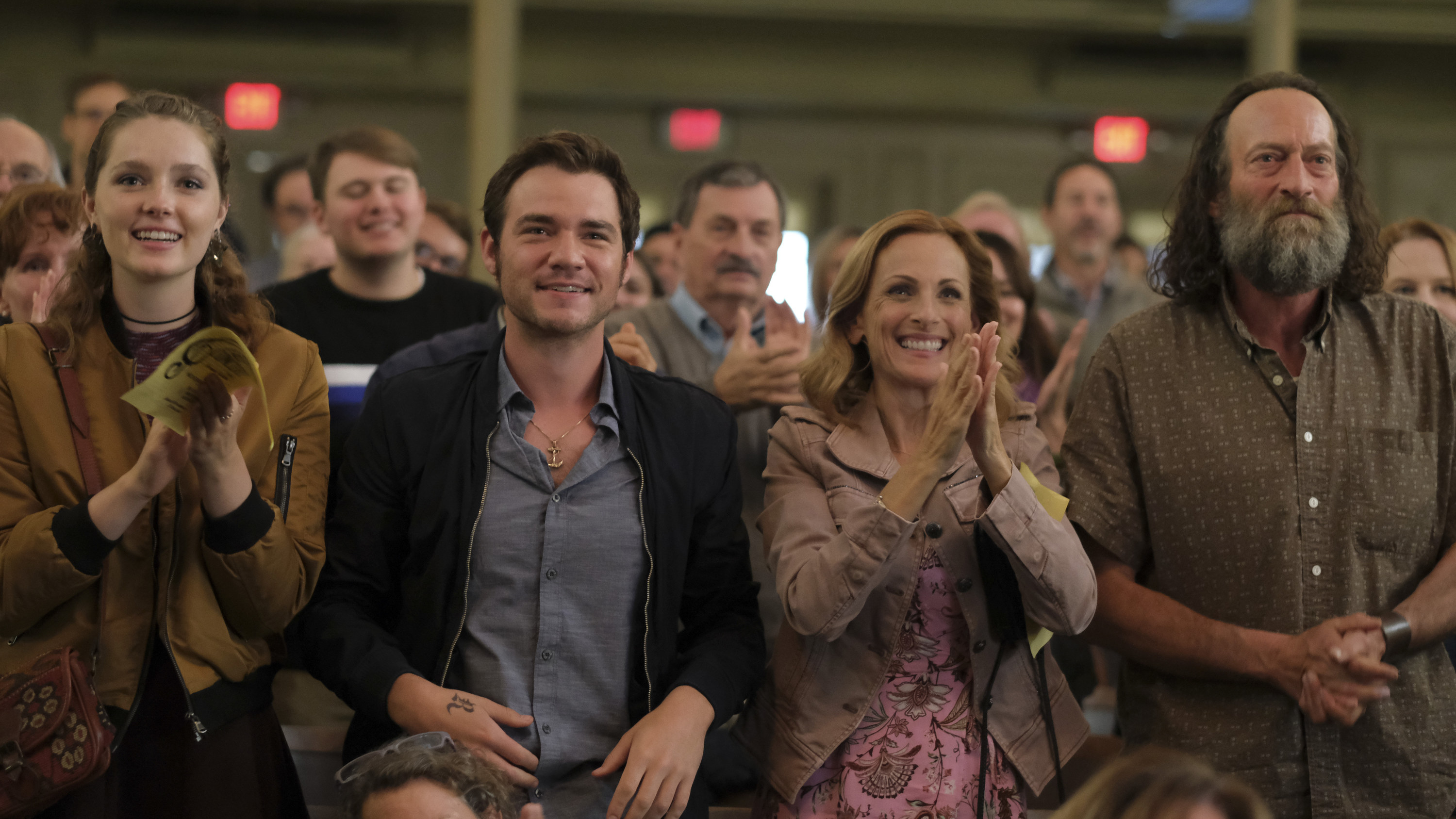 A still from CODA where Ruby&#x27;s family is sitting in the audience of her choir performance