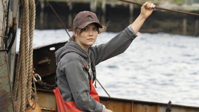 a still from CODA where Ruby is sitting on her family fishing boat