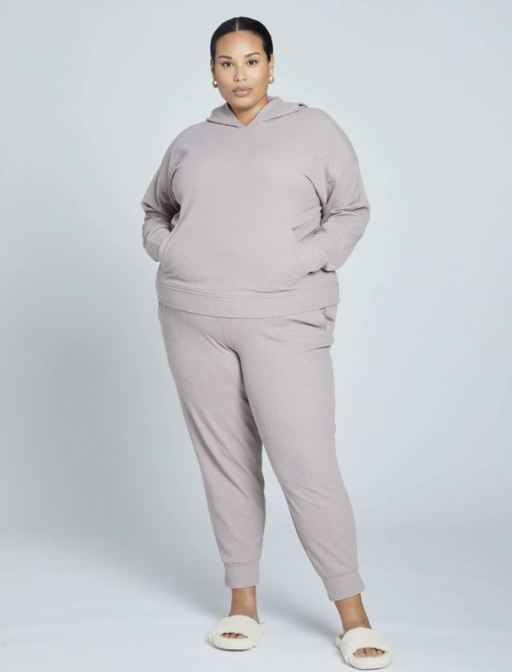 a model in a lilac colored sweat set