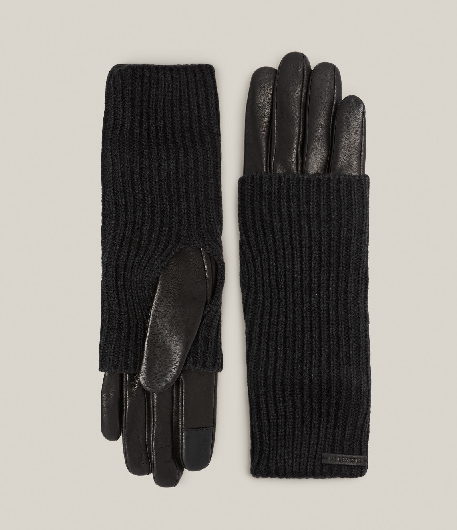 the black knit and black leather gloves