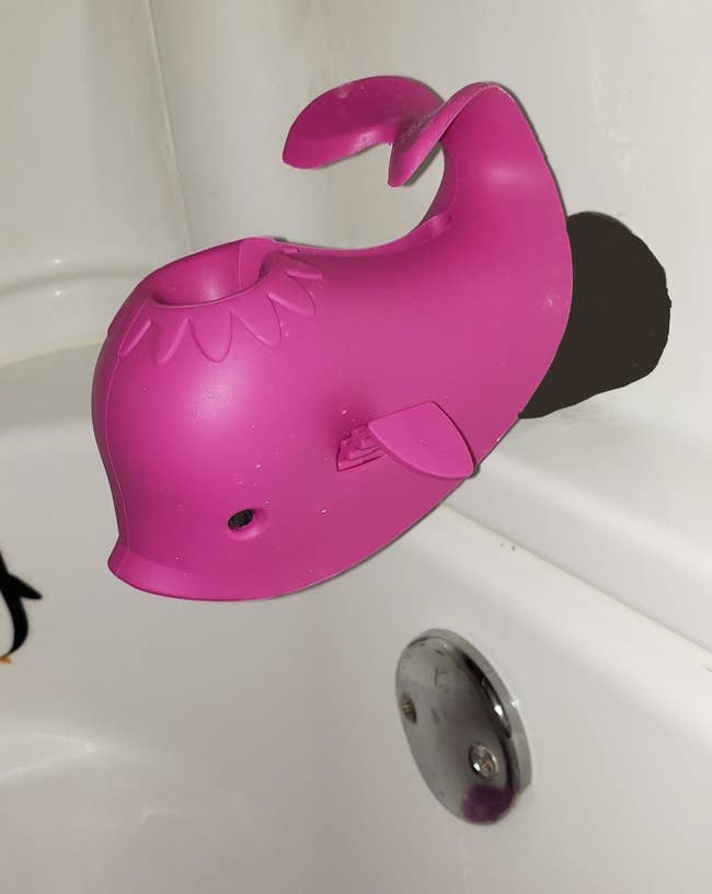reviewer image of the purple whale faucet cover