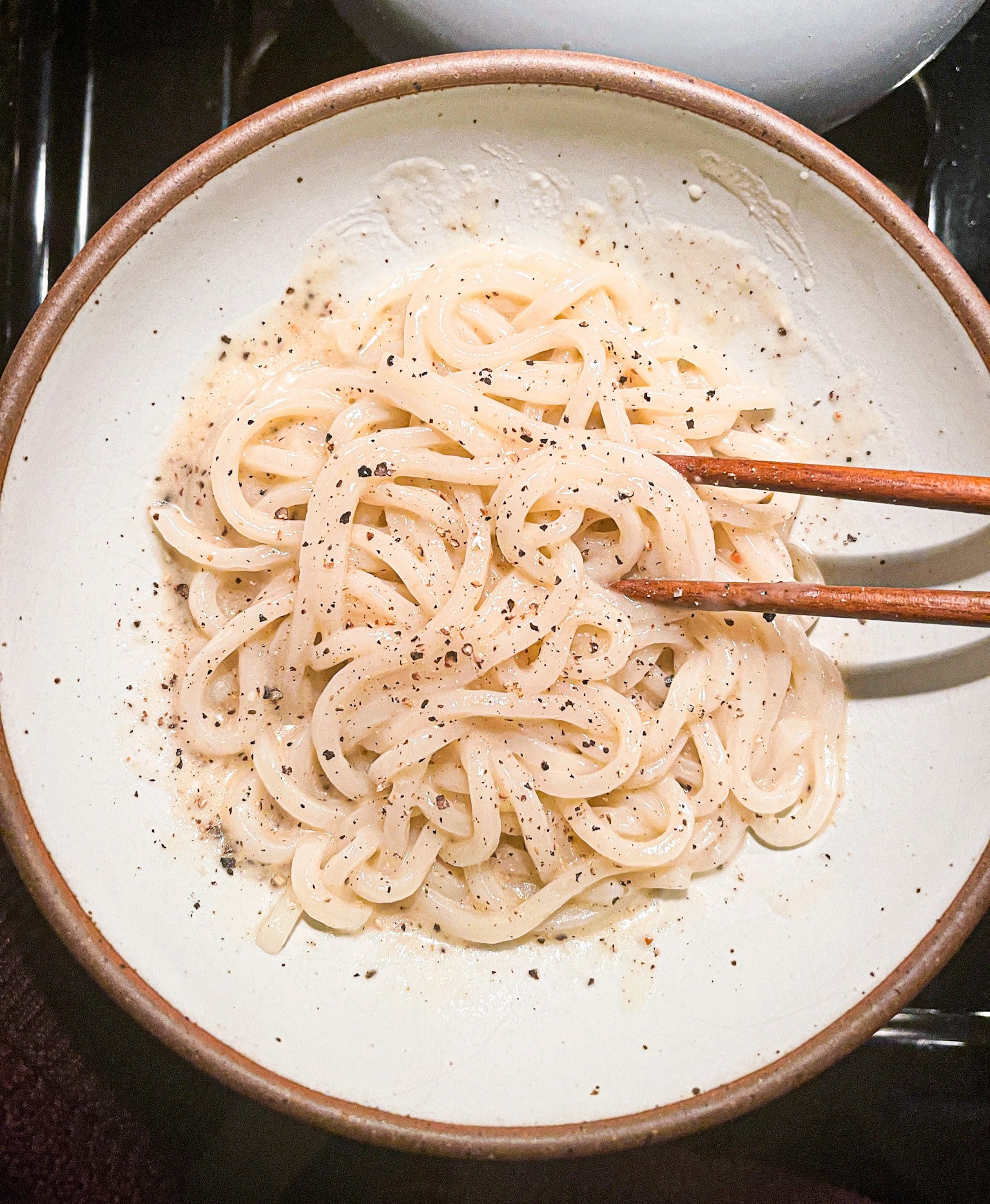 Udon noodles in a white bowl