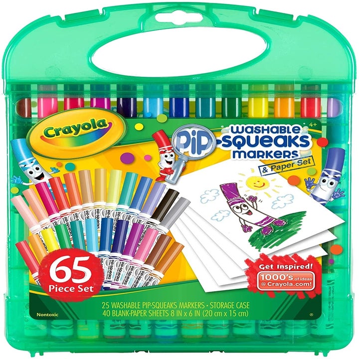 A set of colorful markers in a green storage case