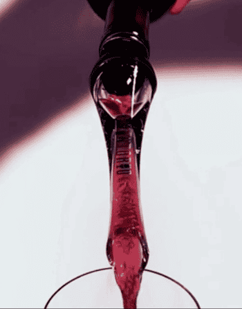 GIF of the wine aerator pourer being used to aerate a bottle of red wine