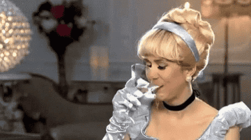 Kristin Wiig drinking a martini.