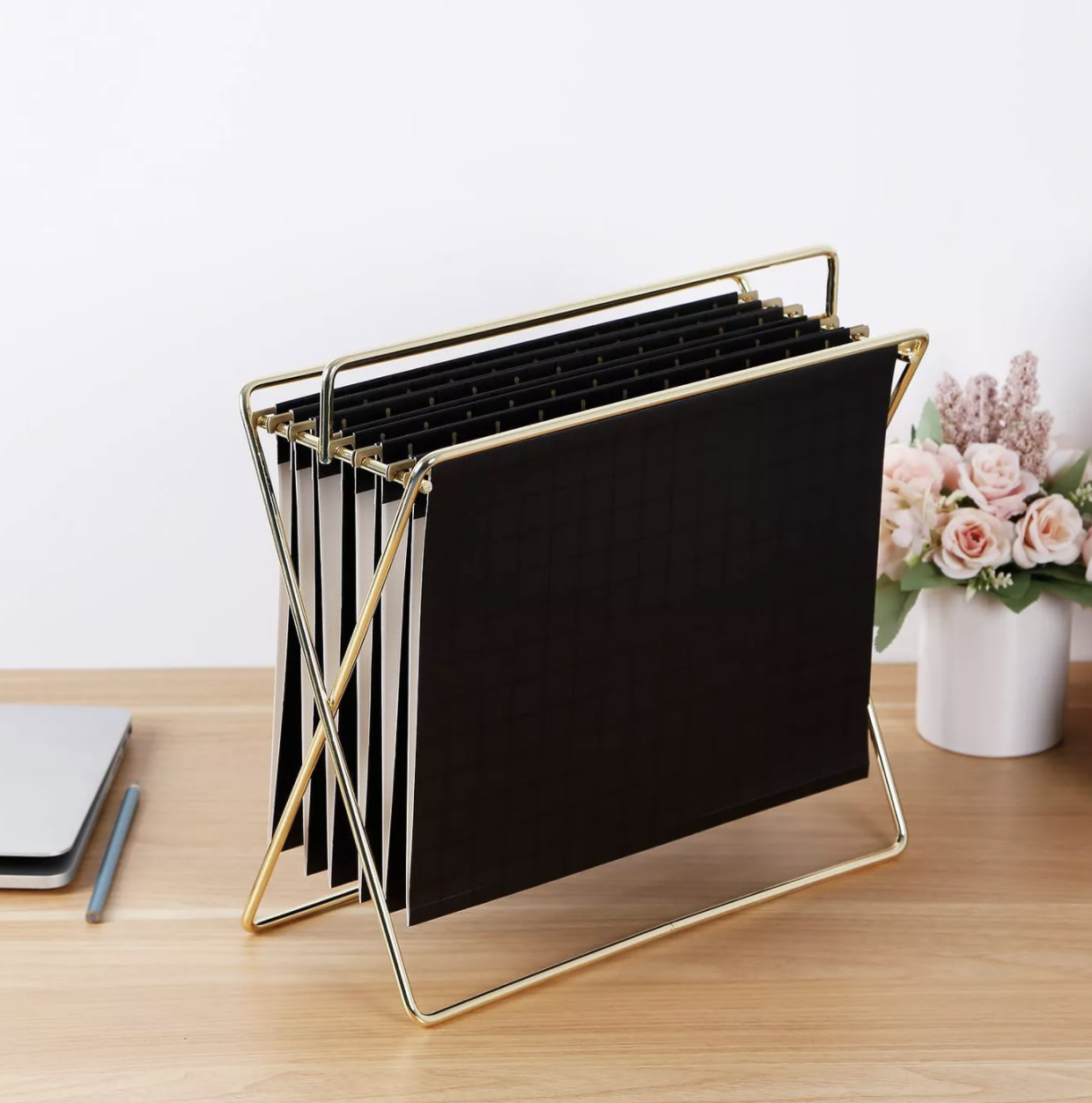 A gold standing file organizer.