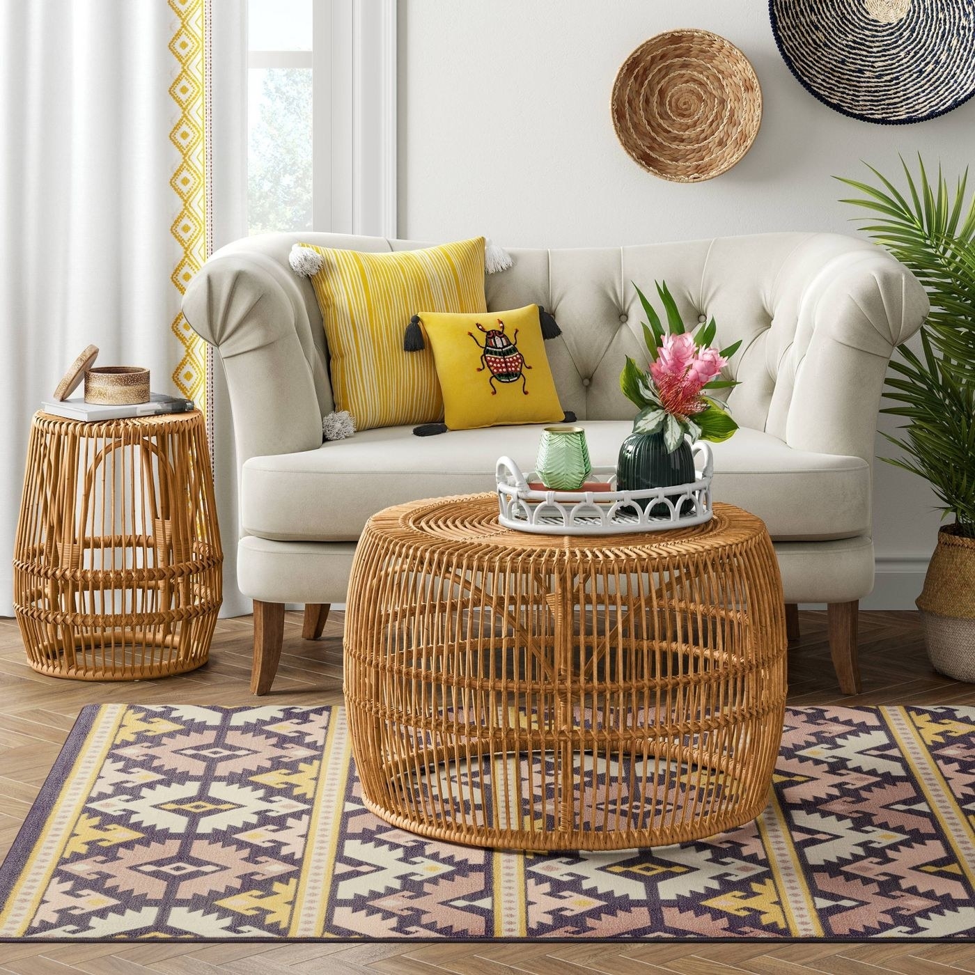 A round rattan coffee table with a tray on it