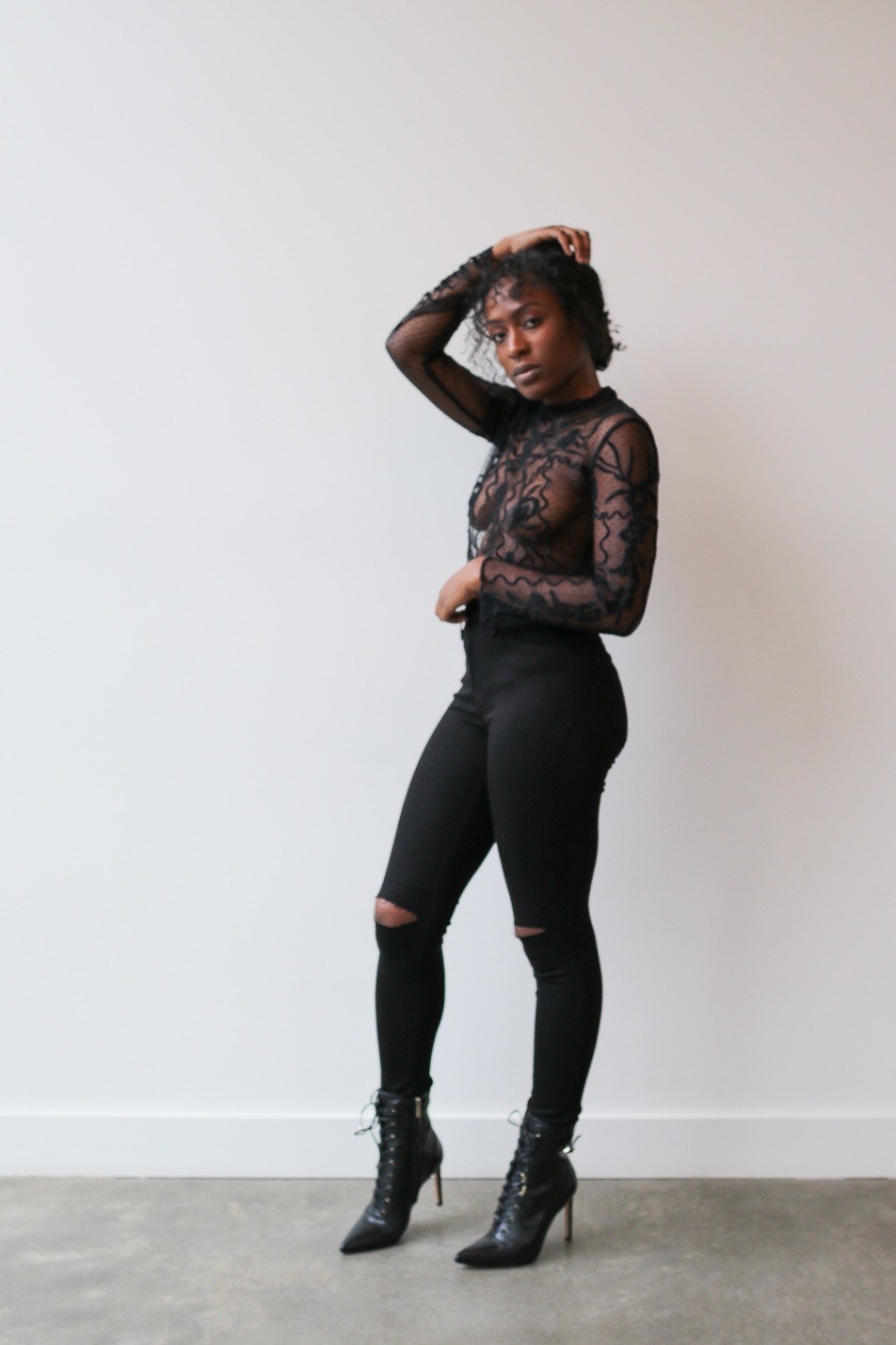 black long sleeve top with black squiggle designs