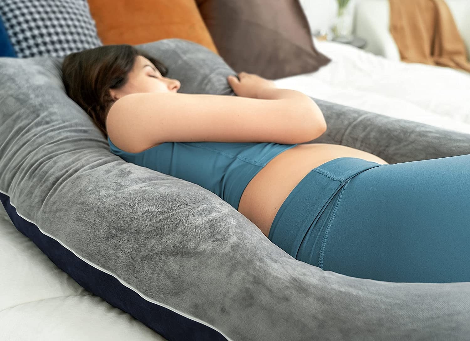 a person laying on their side using the pillow