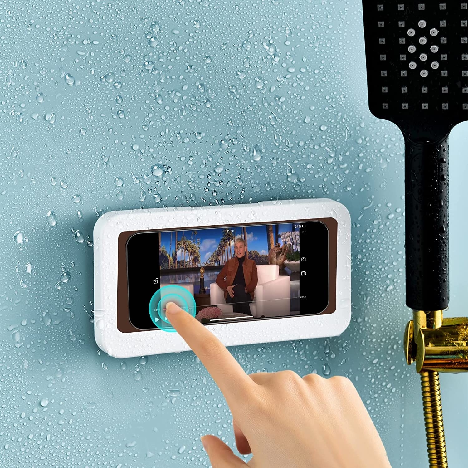 Model&#x27;s hand touching a phone screen while it&#x27;s inside the waterproof mount in the shower