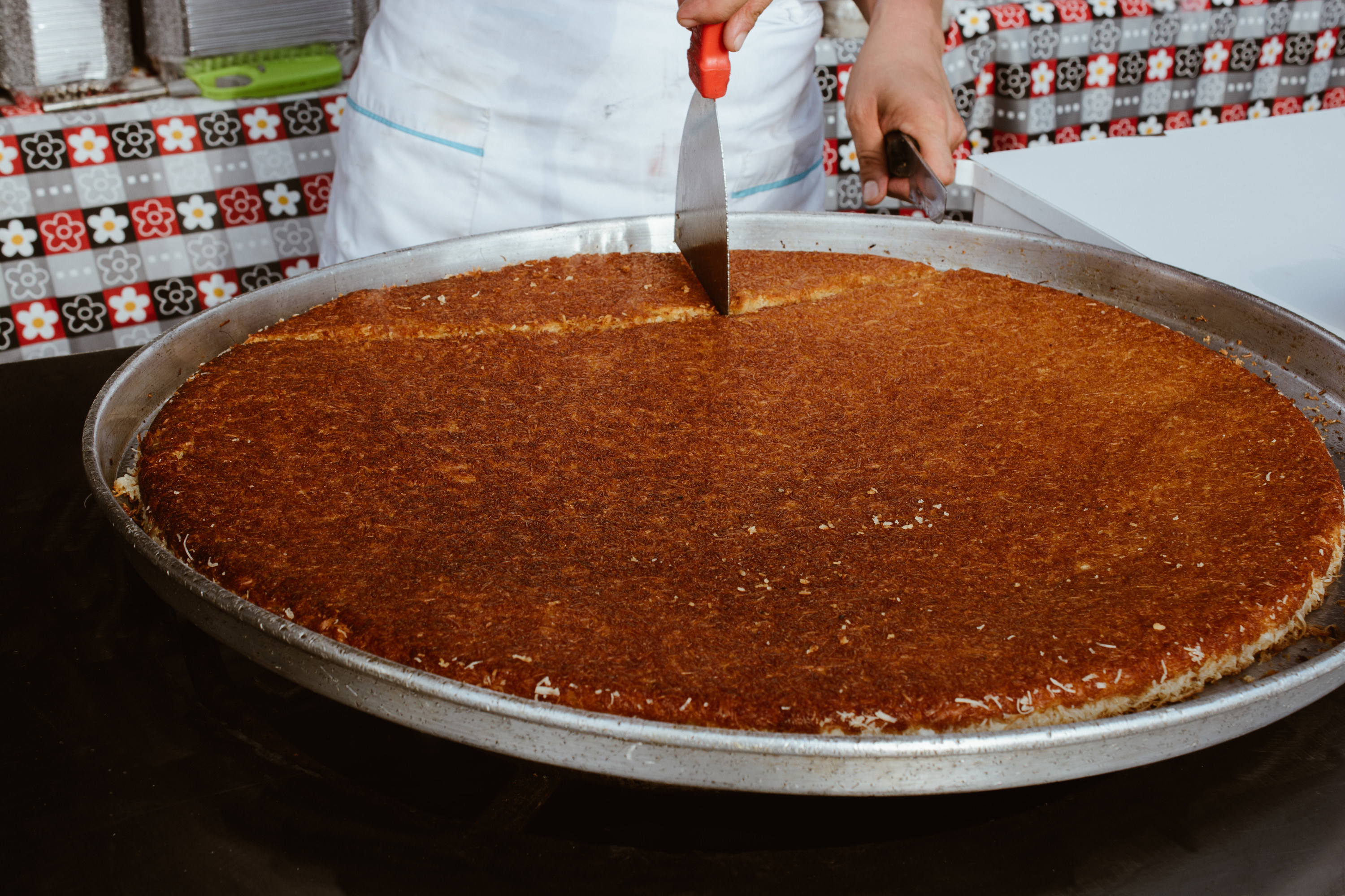 Turkish dessert Kunefe being cut