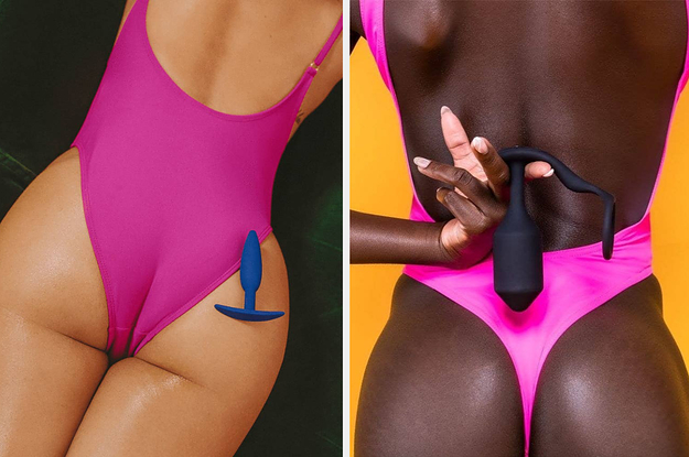 Model with blue butt plug on body and model holding black butt plug and cock ring