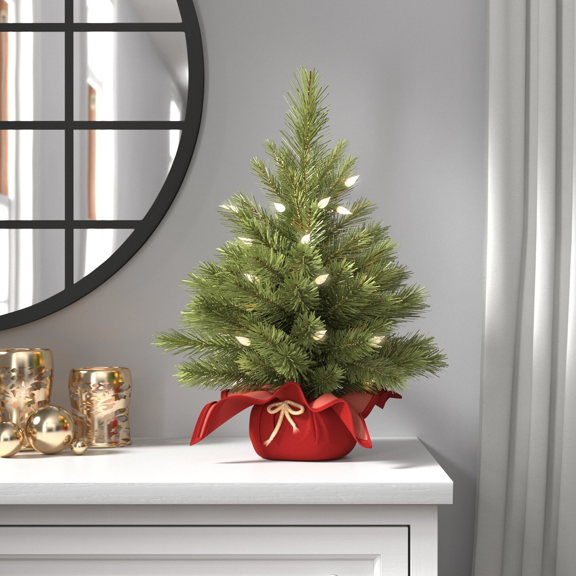 Mini tree on white countertop, with red bag base