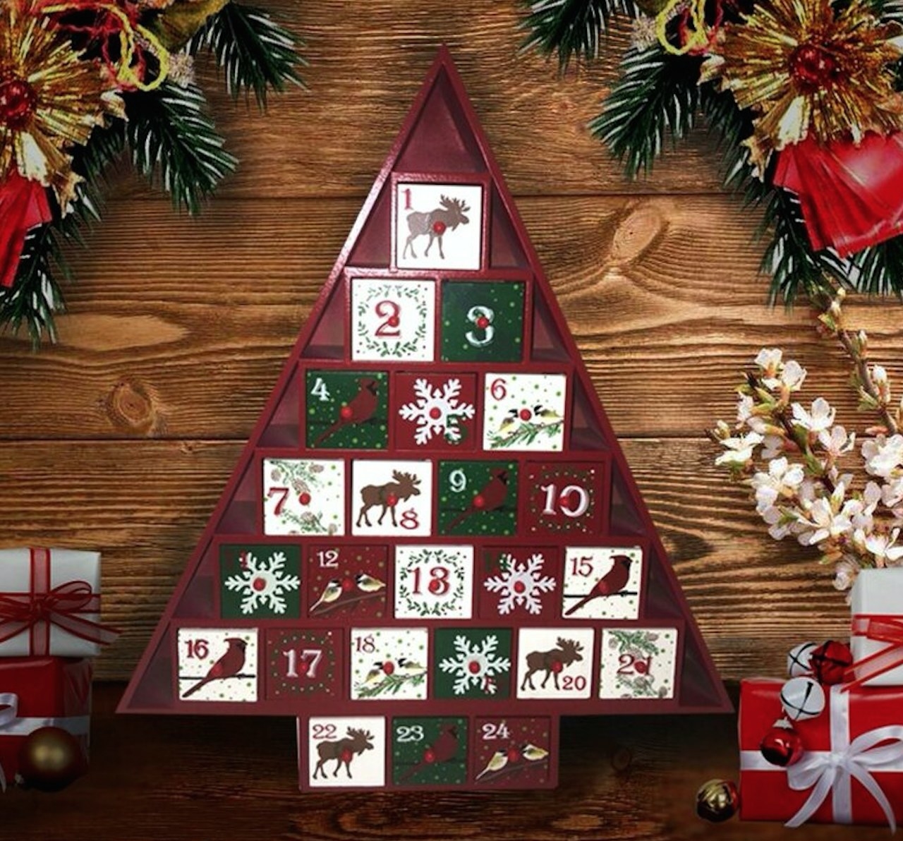 Red tree shaped advent calendar with painted boxes